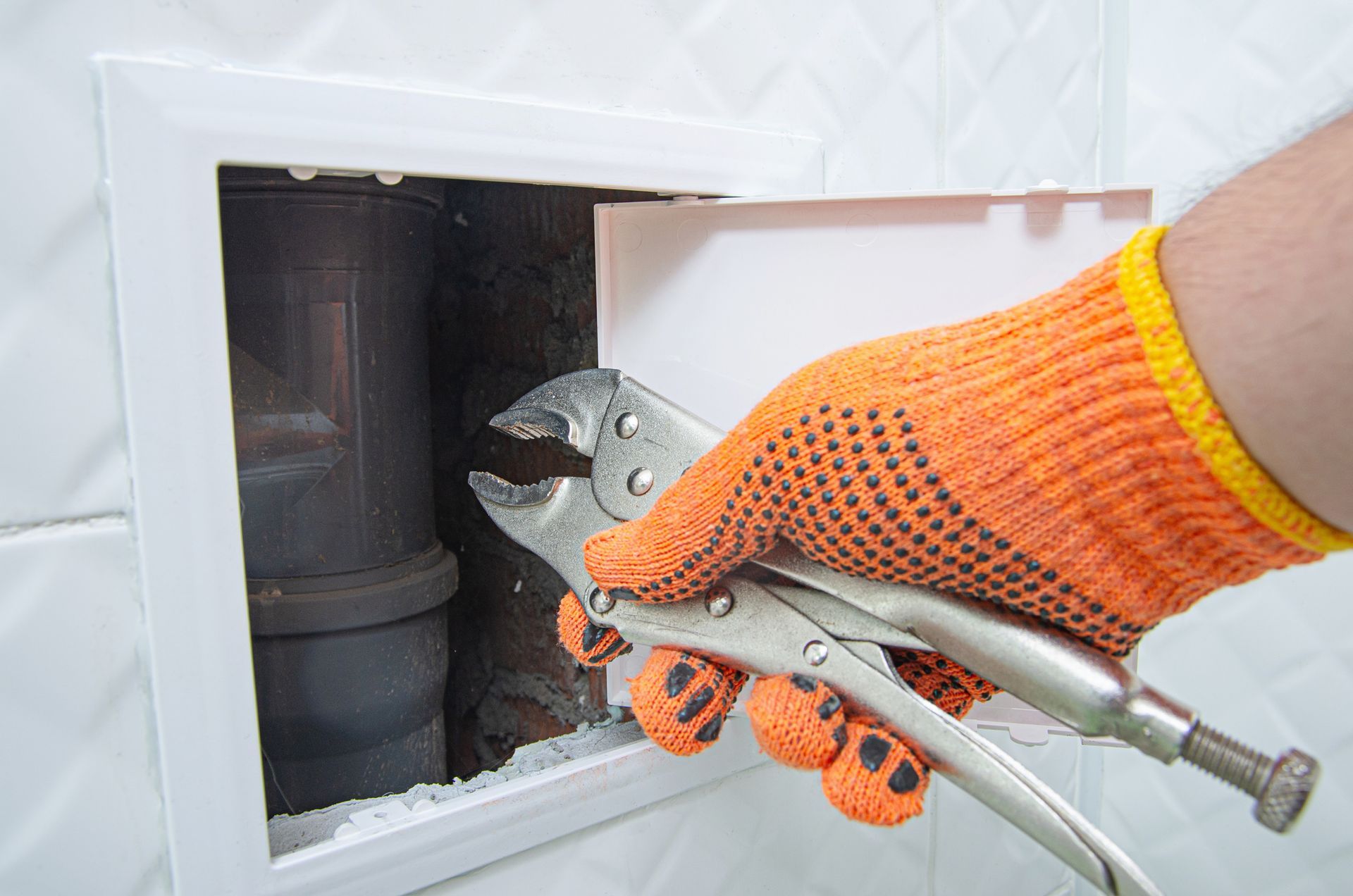 HVAC technician performing a heater tune-up in a Panama City Beach home before winter.