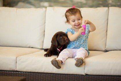 Happy little girl making bubbles - Animal Health Care Clinic in Omaha, NE