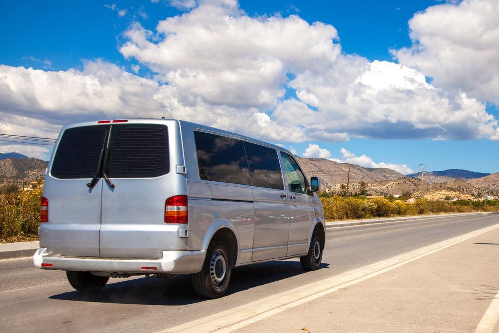 Silver Van Driving on an Asphalt Road — Dave's Drive U Anywhere 24/7 Mini Van Hire In Austinmer, NSW