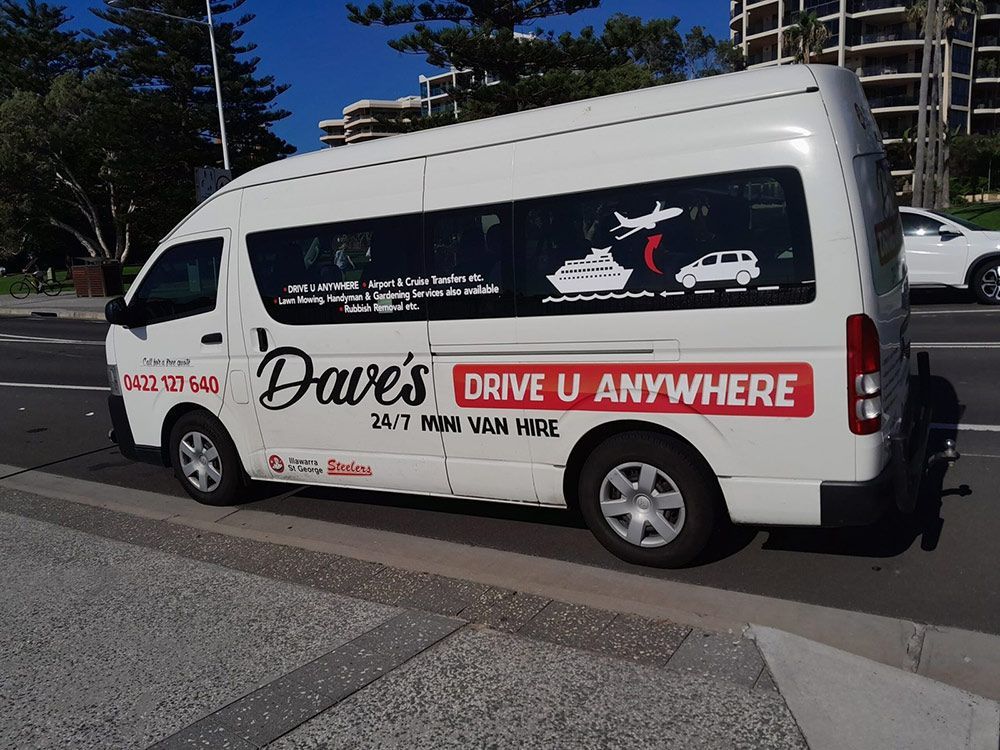 A White Van Is Parked on The Side of The Road — Daves Drive U Anywhere in Wollongong, NSW