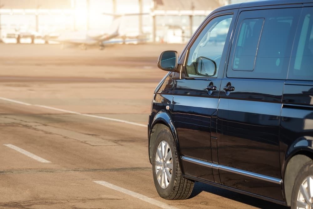 Black Passenger Van Parked — Dave's Drive U Anywhere 24/7 Mini Van Hire In Wollongong, NSW