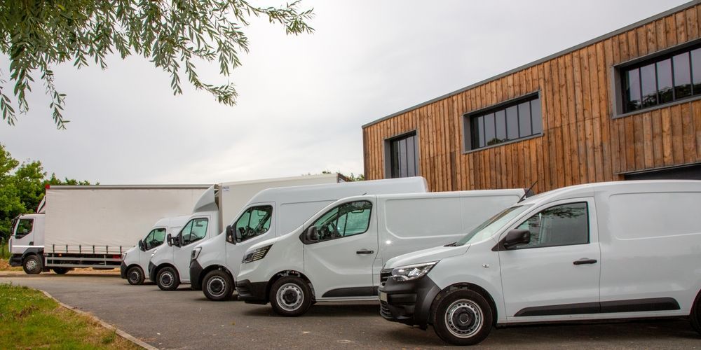 White Delivery Vans Parked — Dave's Drive U Anywhere 24/7 Mini Van Hire In Fairy Meadow, NSW