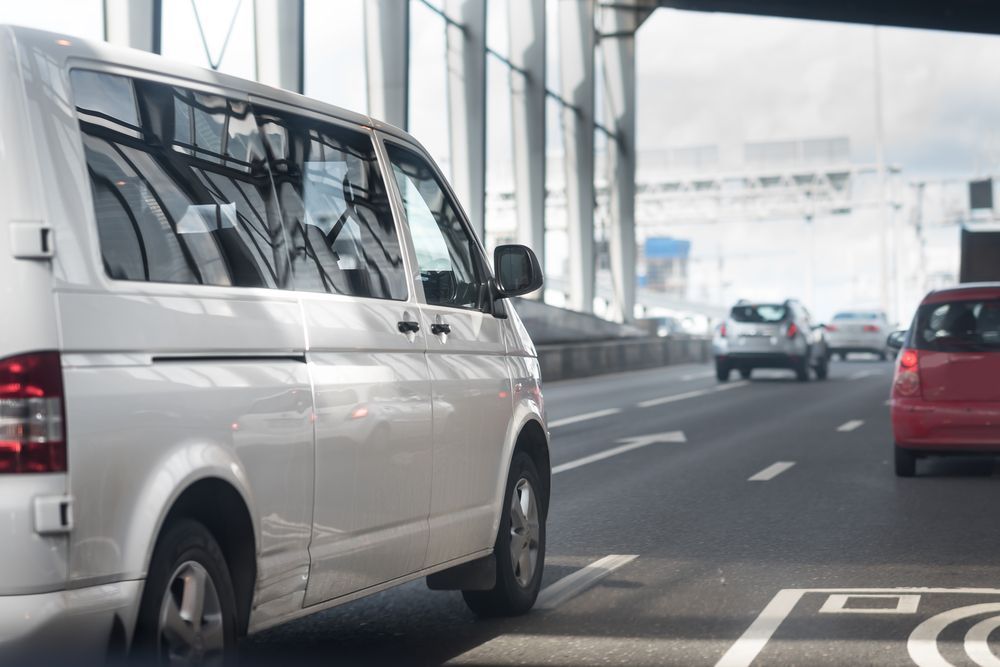 White Van on a Highway With Other Cars — Dave's Drive U Anywhere 24/7 Mini Van Hire In Kiama, NSW