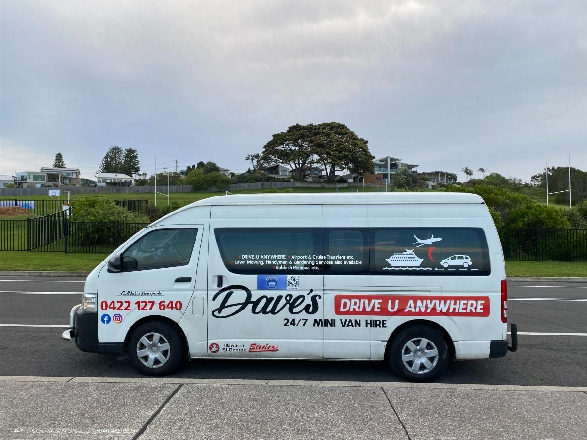 White Dave's Drive U Anywhere Van Parked on Road With Service Details and Contact Info — Dave's Drive U Anywhere 24/7 Mini Van Hire In Bulli, NSW