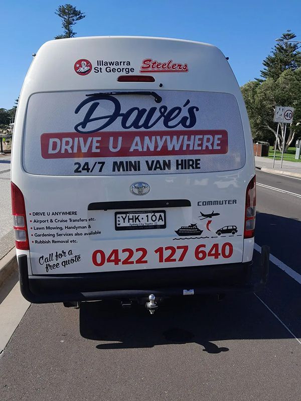A White Van Is Parked on The Side of The Road — Daves Drive U Anywhere in Wollongong, NSW