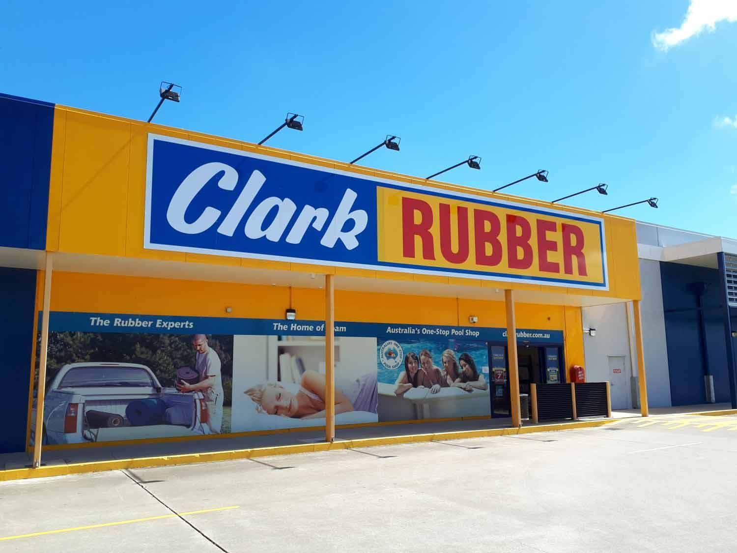 A Clark Rubber Store Is Located In A Parking Lot — Sun City Signs In Moranbah, QLD