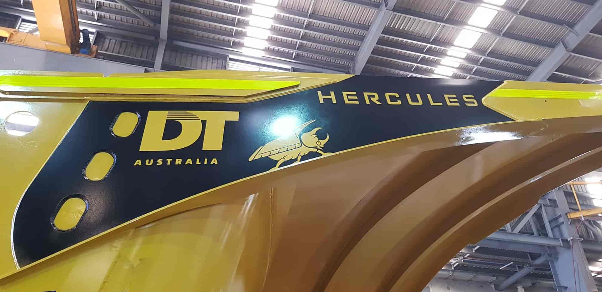 A Yellow Vehicle With The Word Hercules On It — Sun City Signs In Moranbah, QLD