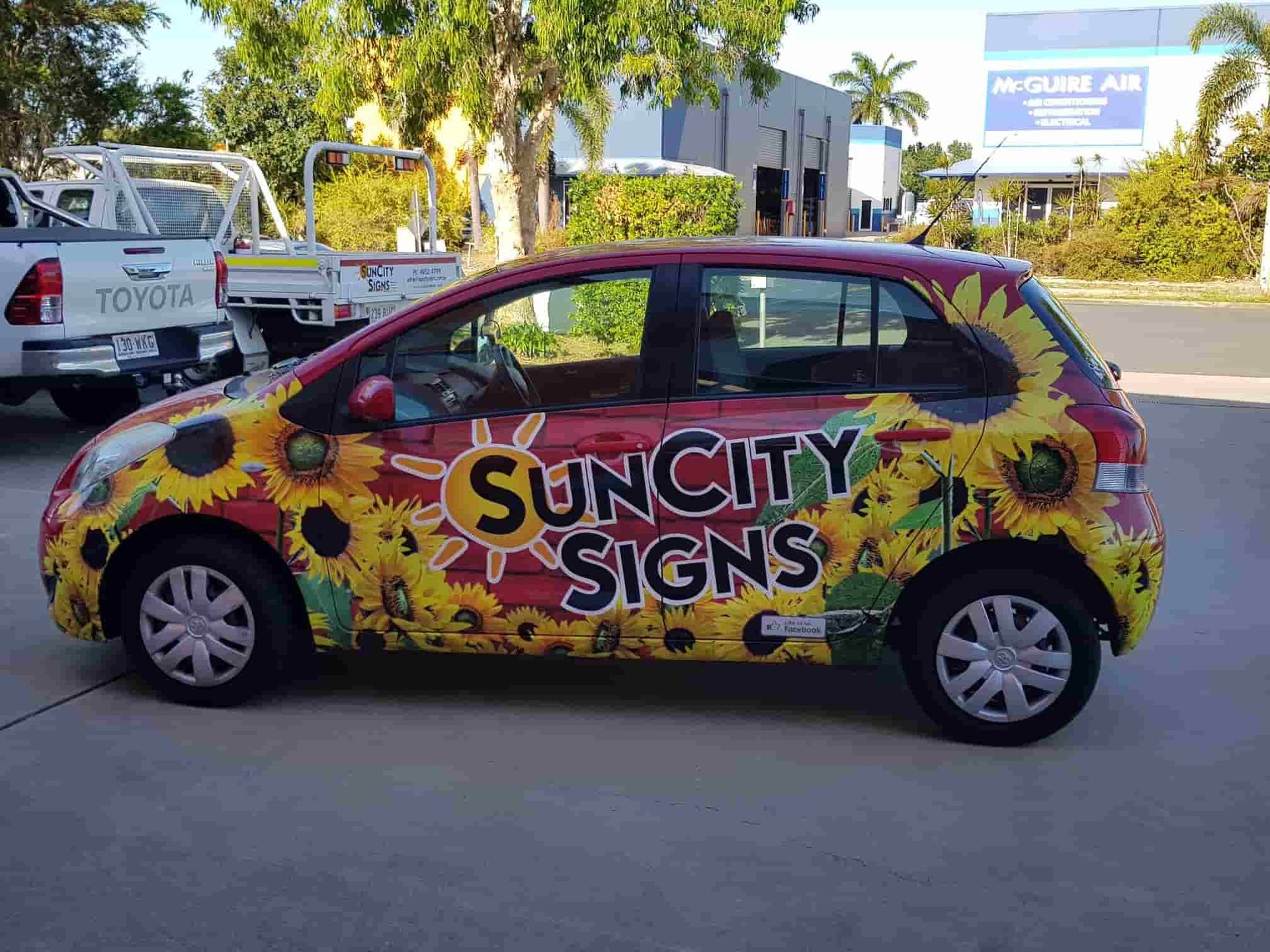 A Vibrant Car Wrap Featuring Suncity Signs, Showcasing Bright Colors And Bold Graphics For Effective Branding — Sun City Signs In Paget, QLD