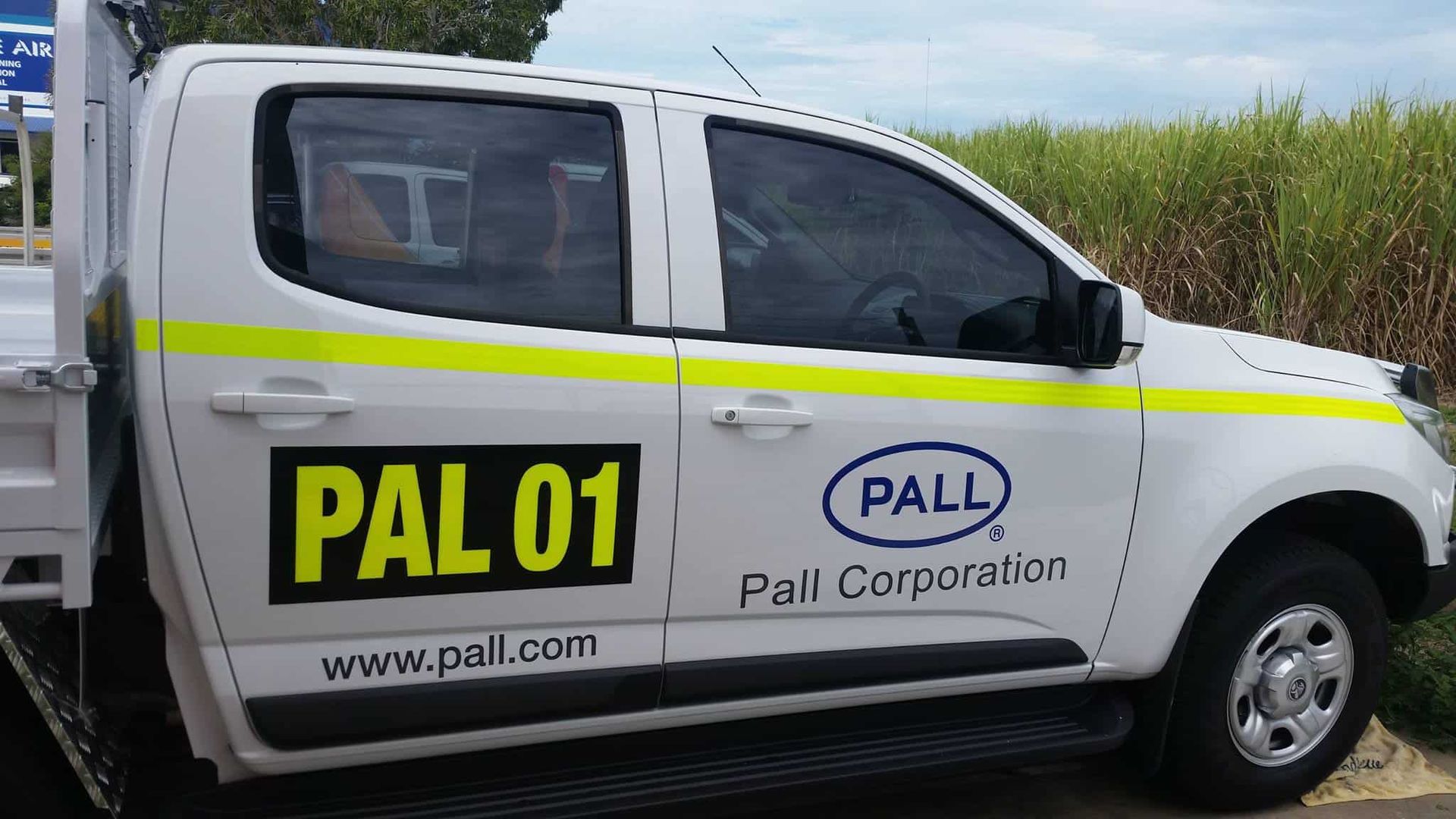 A Row Of Lounge Chairs Sitting Next To A Swimming Pool — Sun City Signs In Paget, QLD