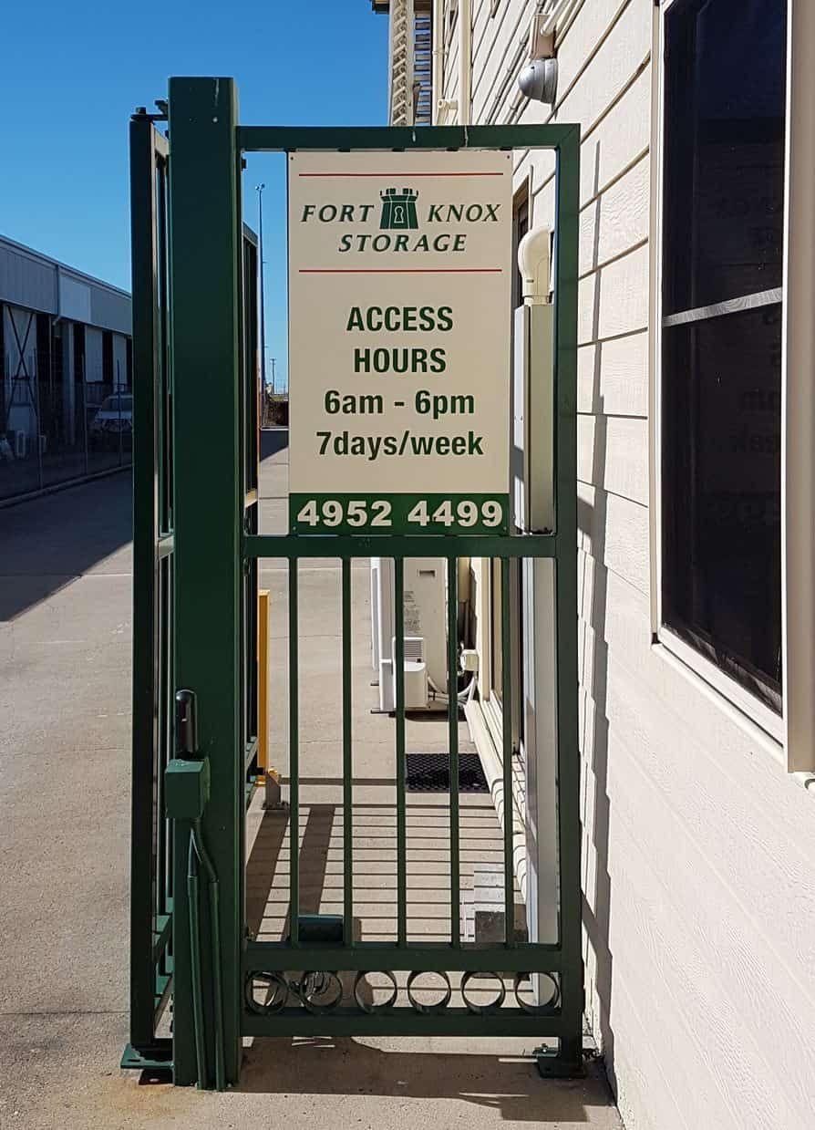 A Gate With A Sign On It That Says Access Hours — Sun City Signs In Moranbah, QLD