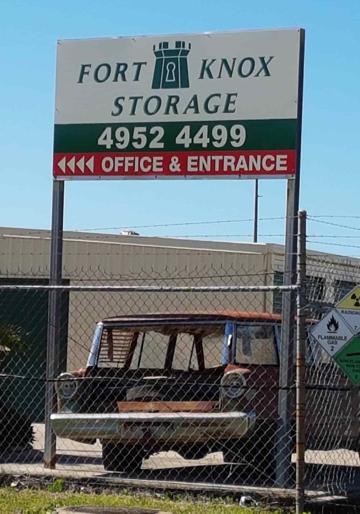 A Sign For Fort Knox Storage Is Behind A Chain Link Fence — Sun City Signs In Dysart, QLD