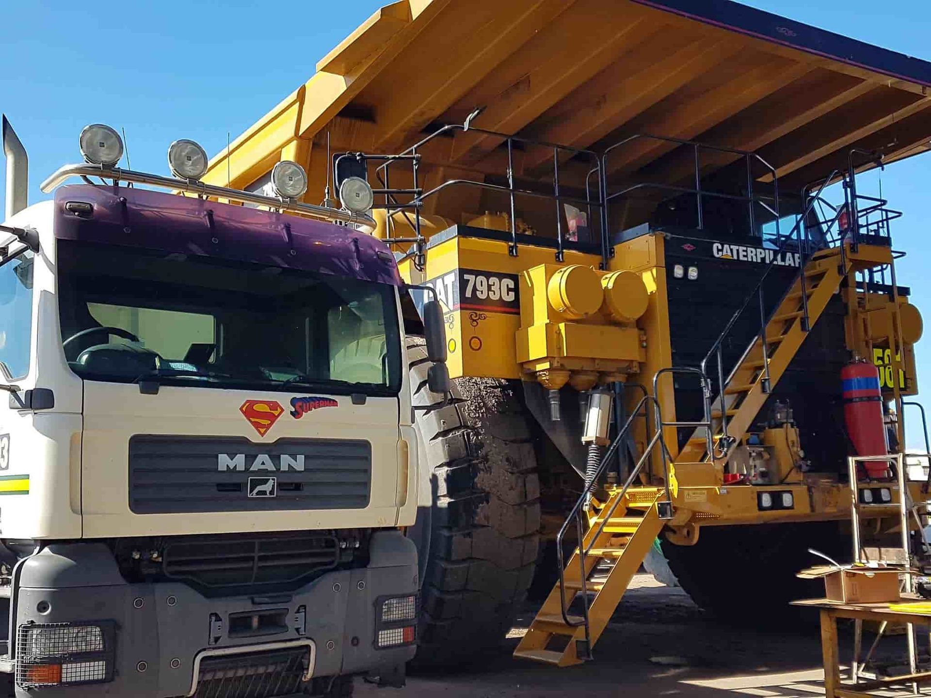 A Row Of Lounge Chairs Sitting Next To A Swimming Pool — Sun City Signs In Paget, QLD