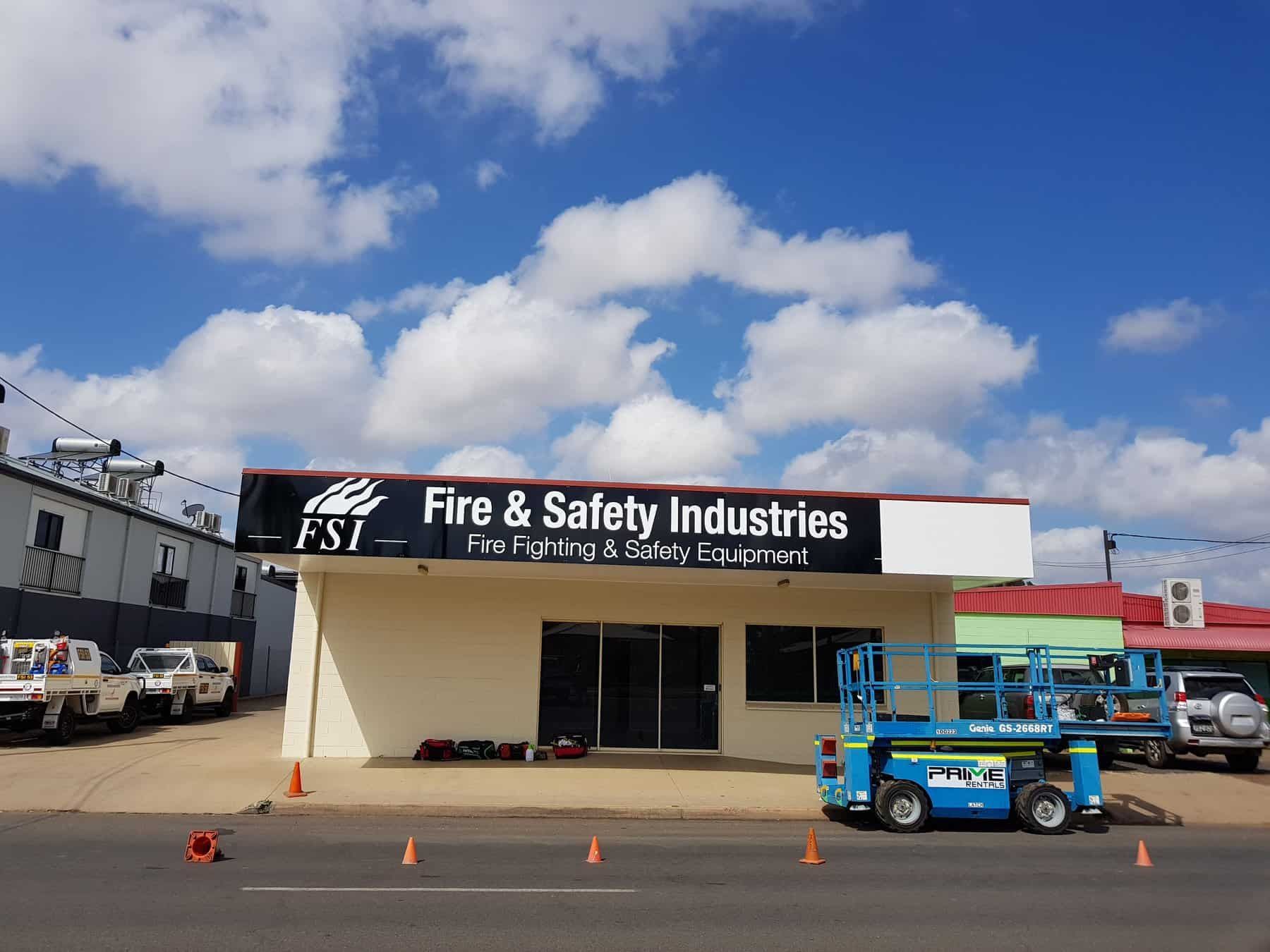 A Building With A Sign That Says Fire & Safety Industries — Sun City Signs In Paget, QLD
