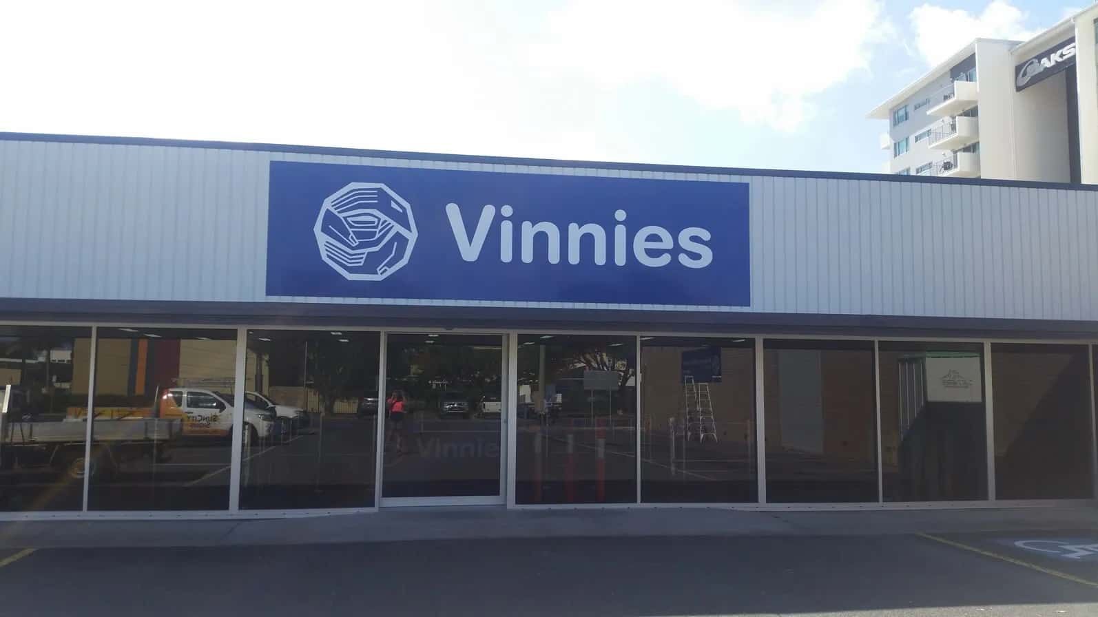 A Store Front With A Blue Sign That Says 'Vinnies' On It — Sun City Signs In Paget, QLD