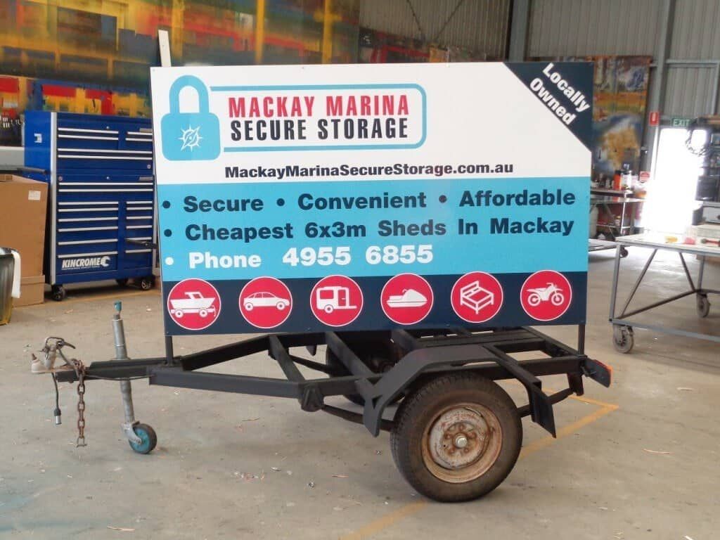 A Trailer With A Sign That Says Mackay Marina Secure Storage — Sun City Signs In Paget, QLD