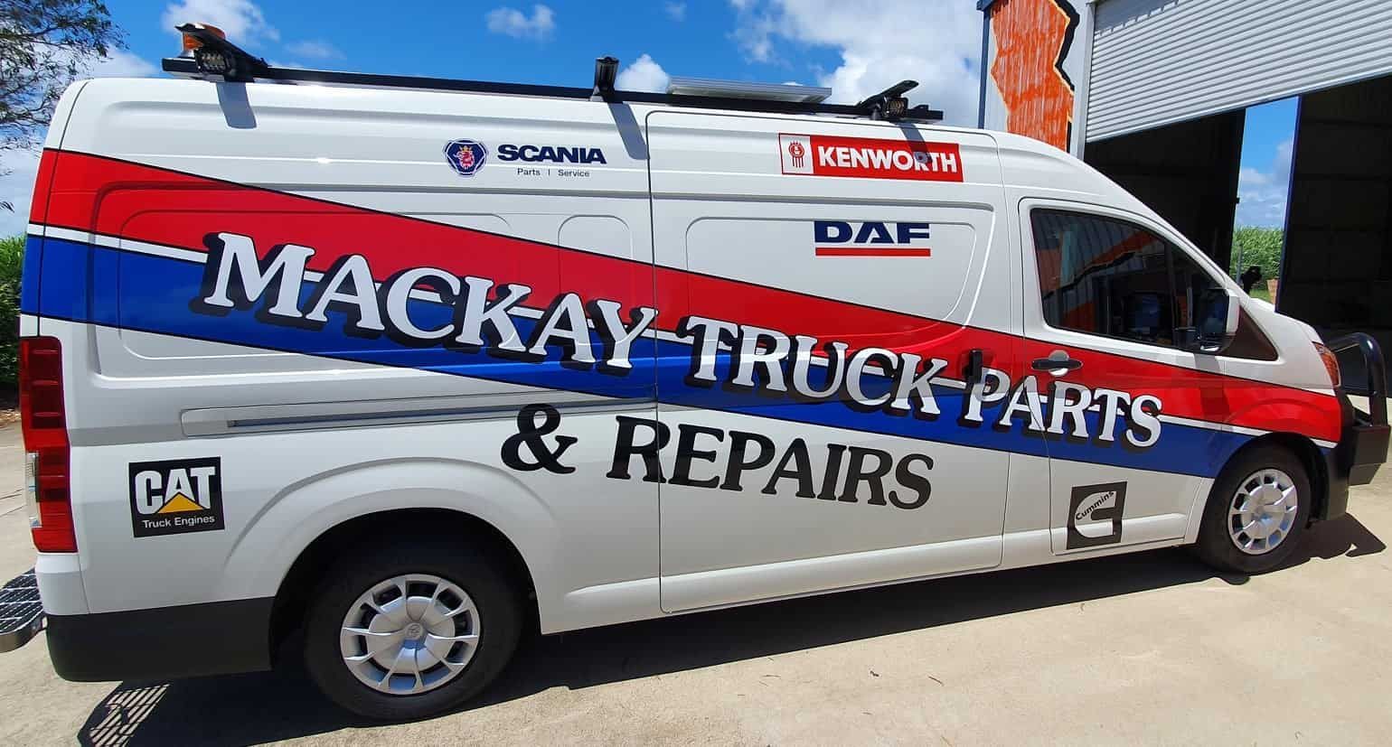 A Mackay Truck Parts And Repairs Van Is Parked In Front Of A Building — Sun City Signs In Dysart, QLD