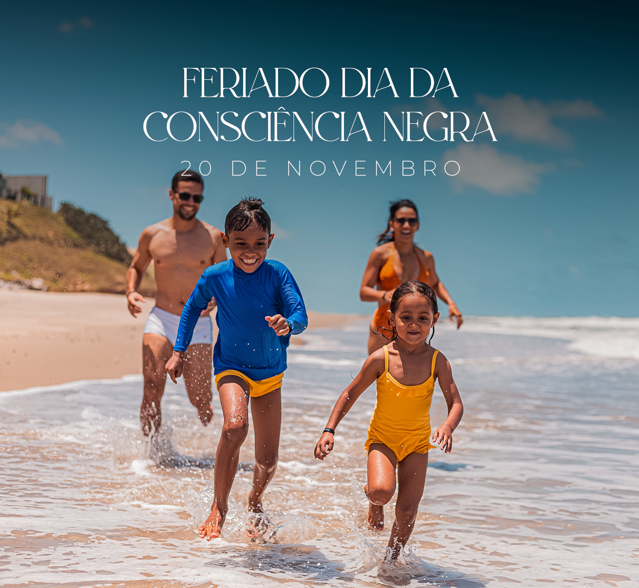Family running through surf on a sunny beach with “Feriado da Consciência Negra” text above