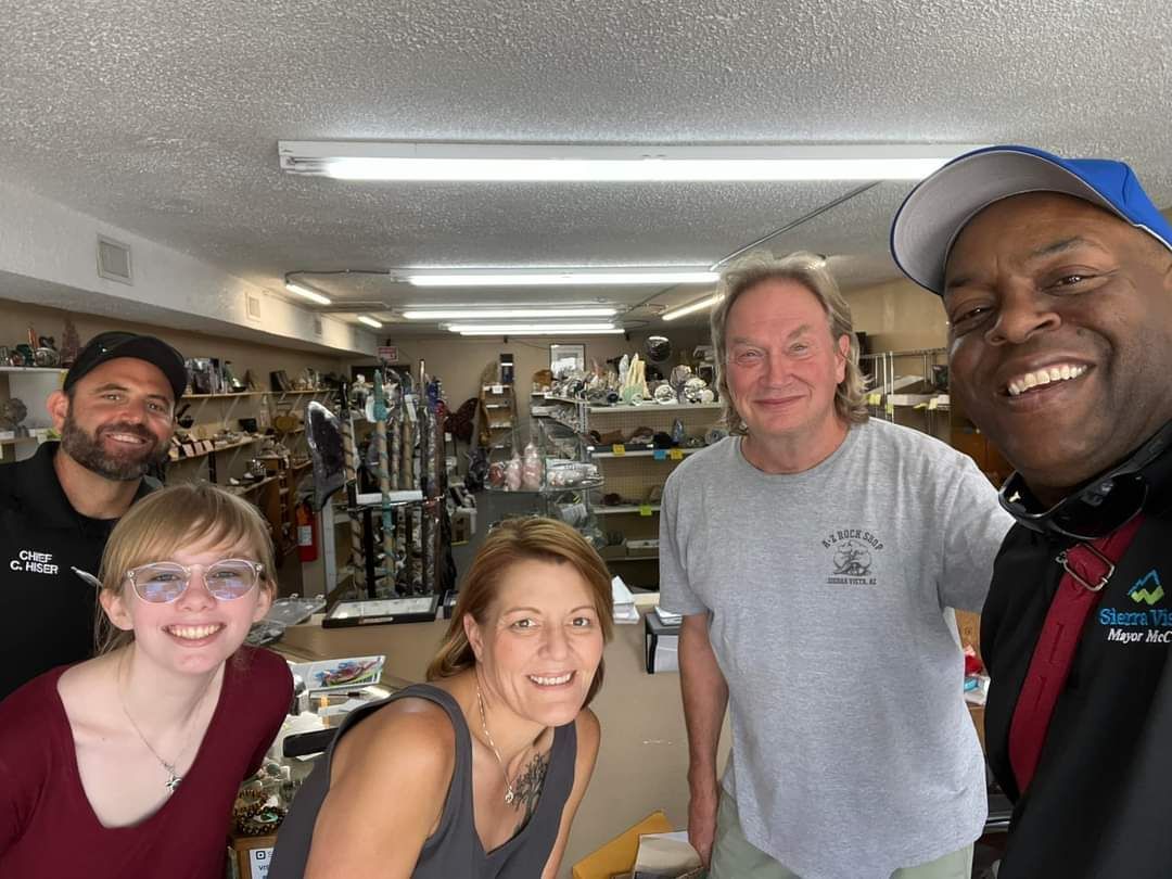 A group of people posing for a picture in a store