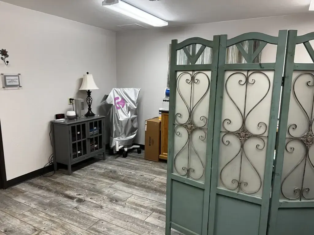 There is a room divider in the middle of the room.