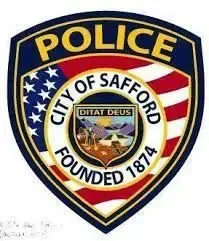 The logo for the city of safford police department is a badge with an american flag on it.