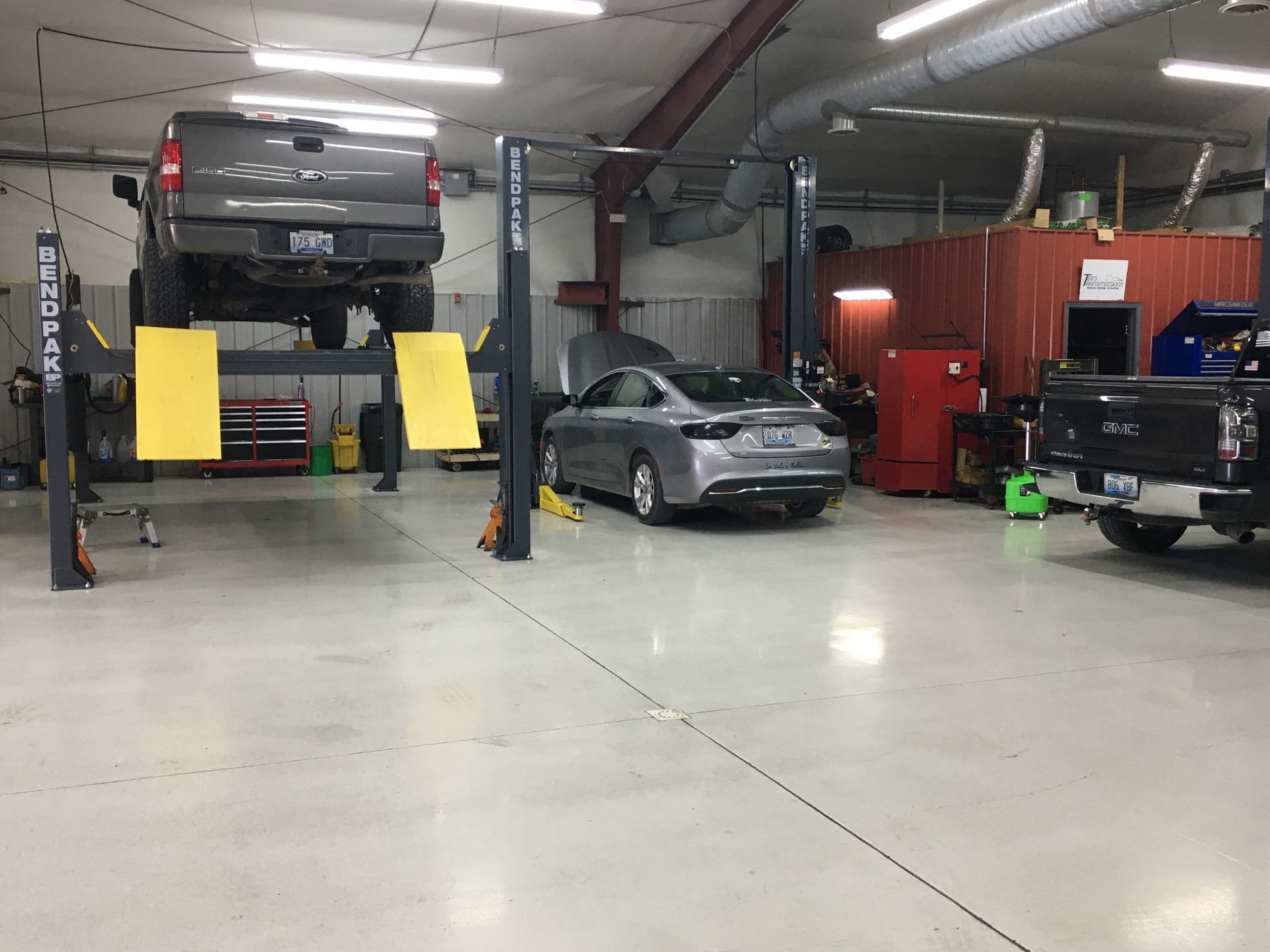 Vehicles Lifted in Auto Repair Bay with Diagnostic Equipment | Tex's Transmissions Complete Auto & Truck Care