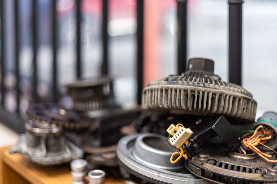 Assorted Used Auto Parts and Components on Display Shelf | Tex's Transmissions Complete Auto & Truck Care
