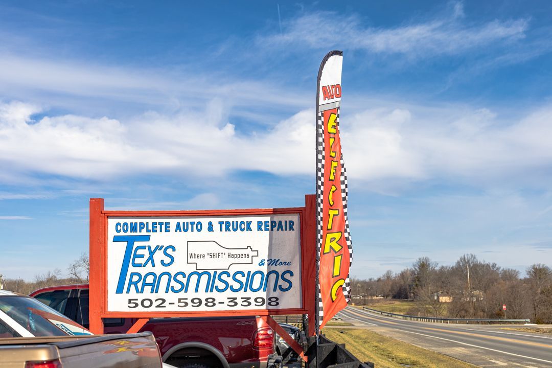 Outdoor Signage for Tex’s Transmissions with Flags and Banners | Tex's Transmissions Complete Auto & Truck Care