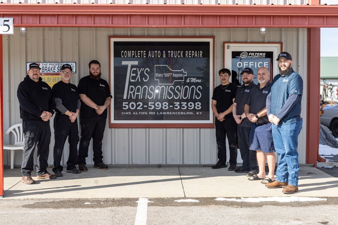 Team Standing in Front of Tex's Transmissions Shop Sign | Tex's Transmissions Complete Auto & Truck Care
