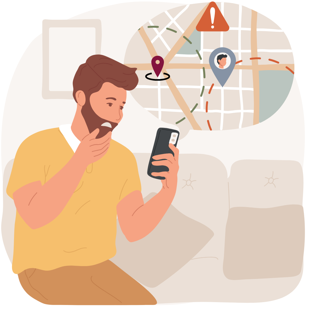 A man is sitting on a couch looking at his cell phone.