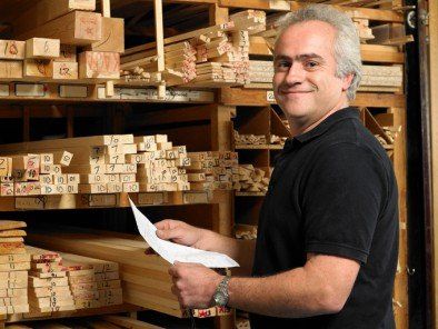 Man Checking Lumber Stack — Building Supplies in Eugene, OR