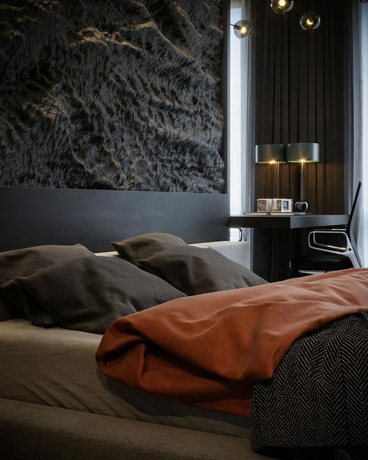 A bedroom with a large bed and a desk