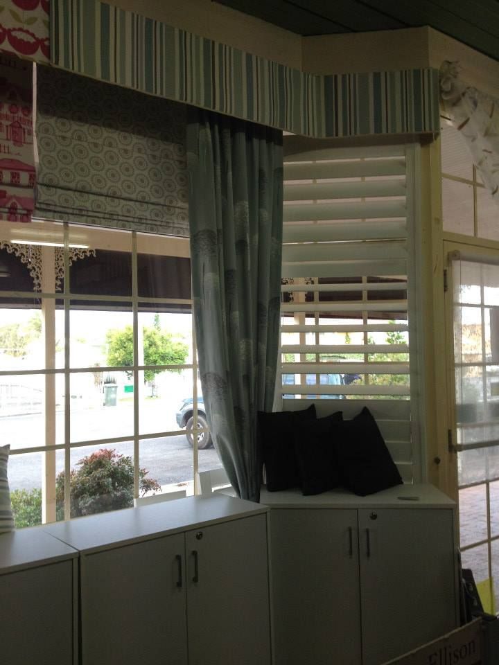 A Corner of a Room With a Window and Curtains — Curtain Haven & Blinds in Laurieton, NSW
