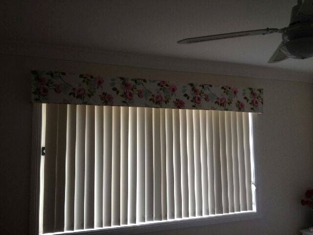 A Window With Blinds and a Ceiling Fan in a Room — Curtain Haven & Blinds in Laurieton, NSW