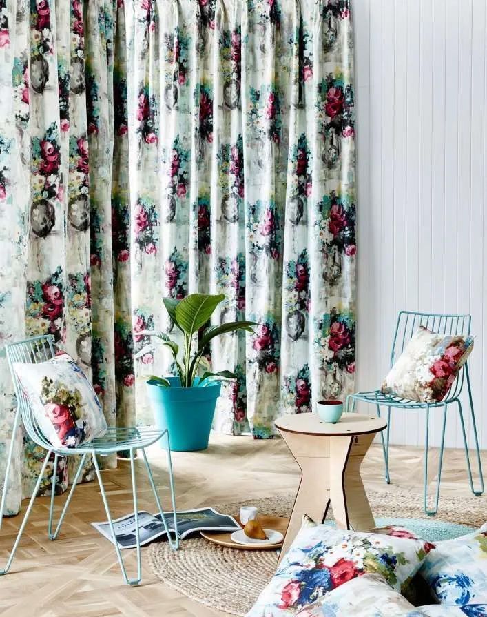 Room with Floral Curtains, Blue Chairs, a Plant, and Pillows — Curtain Haven & Blinds in Port Macquarie, NSW
