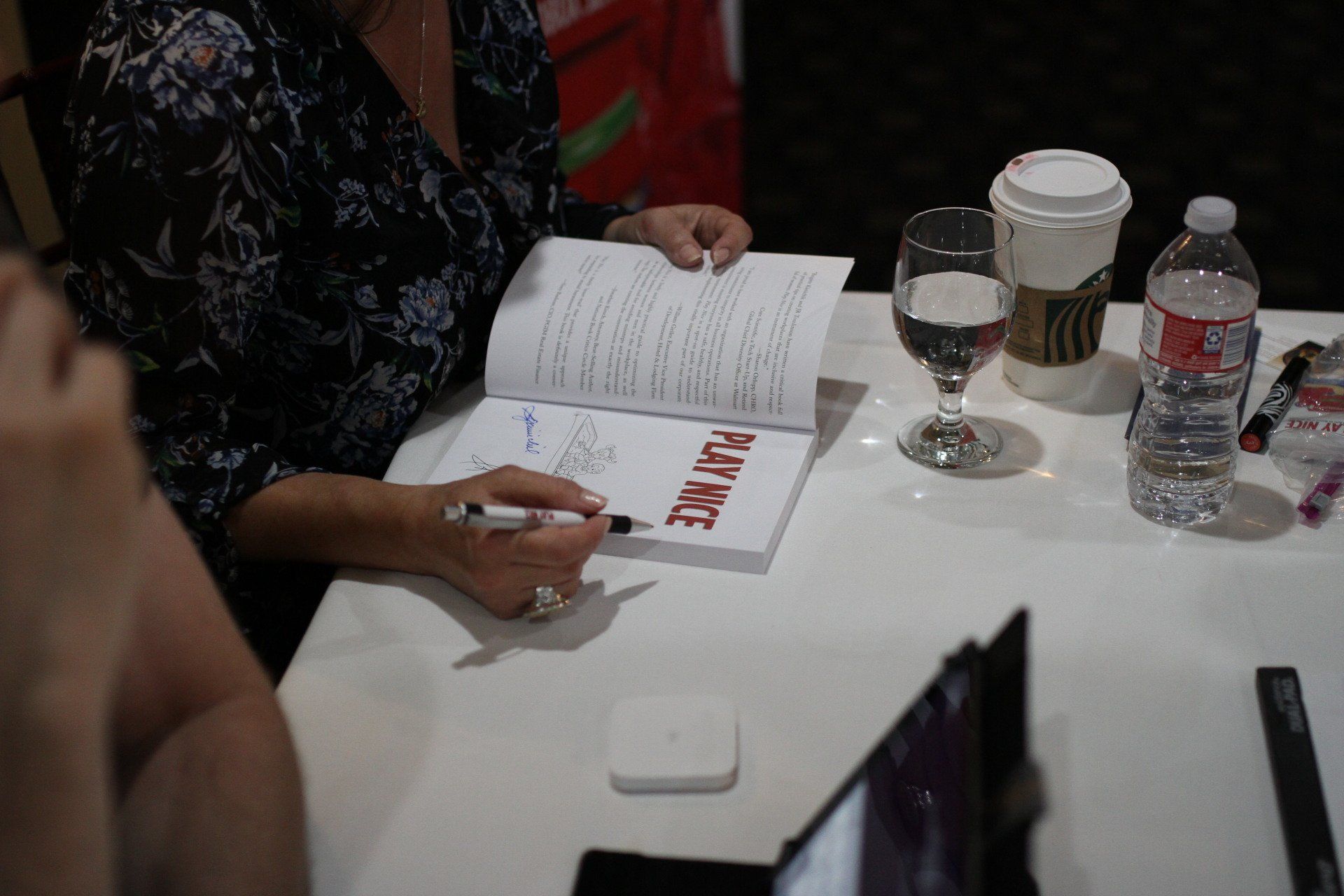 Brigitte Kimichik signing copies of Play Nice during author event 