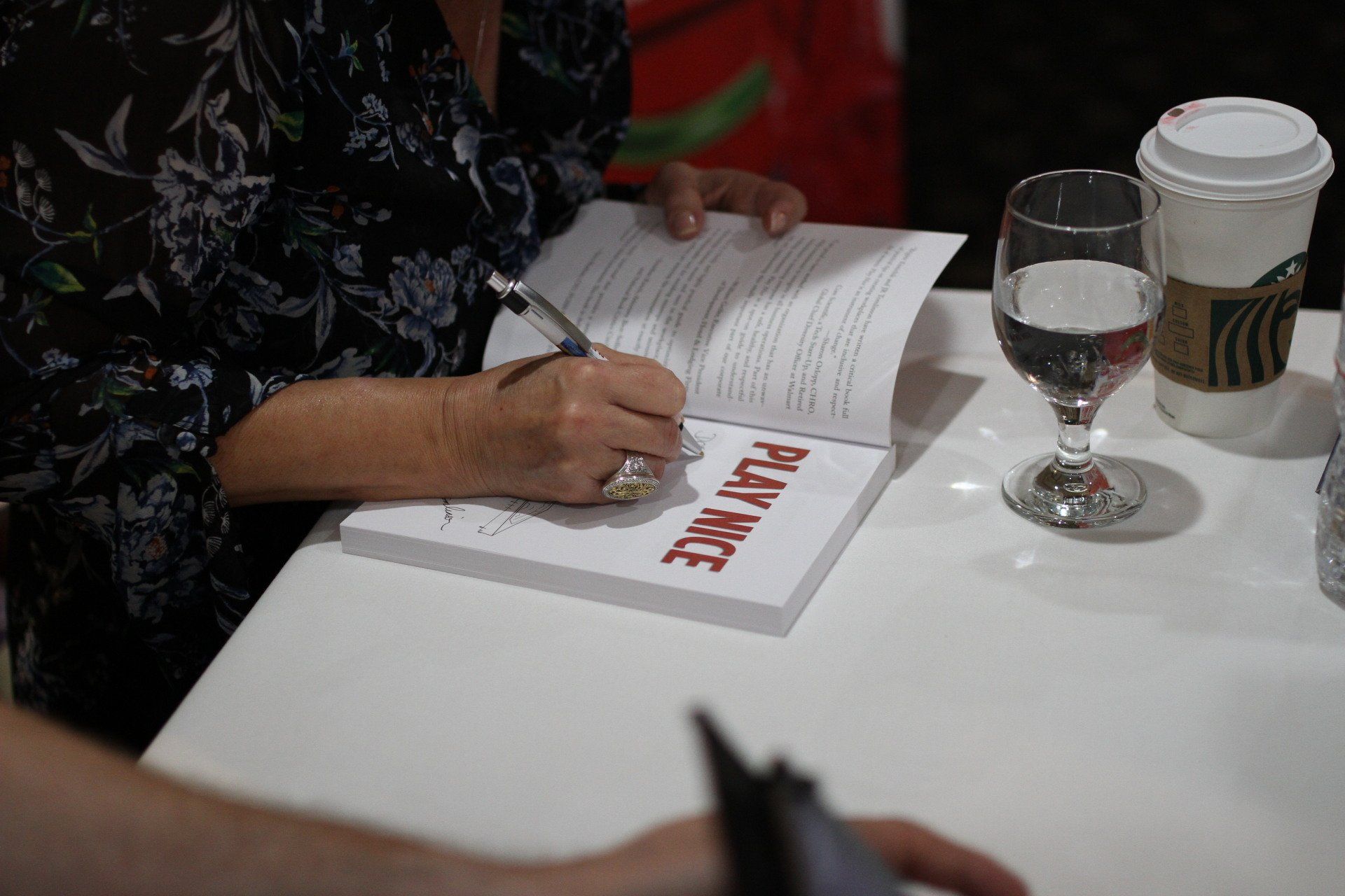 Brigitte Kimichik signing copies of Play Nice during author event