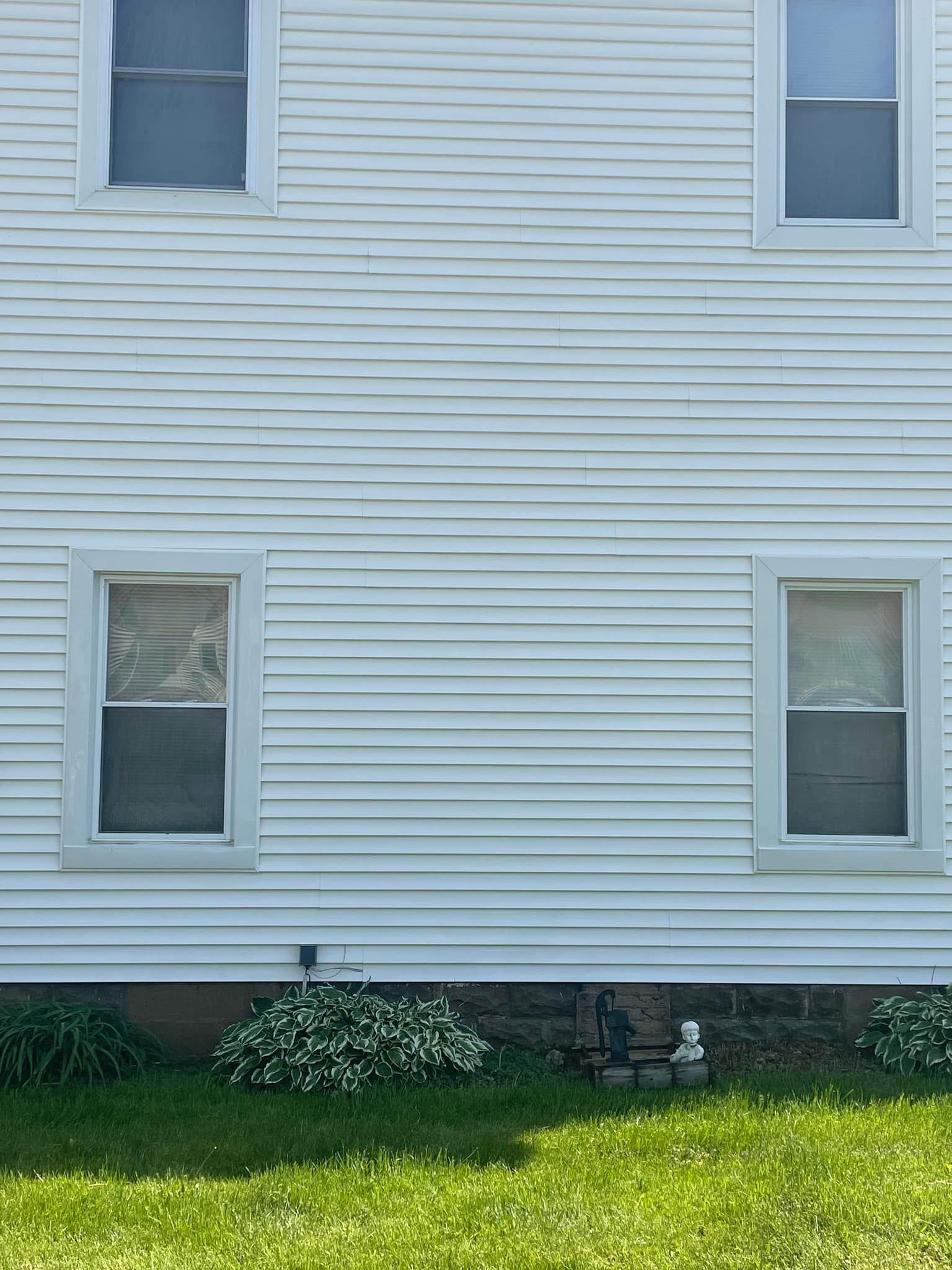 A large brick building with a crane on top of it.