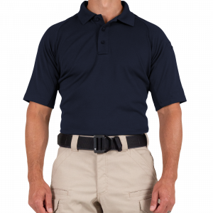 A man wearing a blue polo shirt and khaki pants
