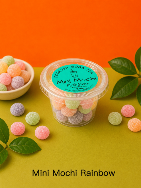 Mini mochi rainbow candy cups with pastel balls on orange and yellow background