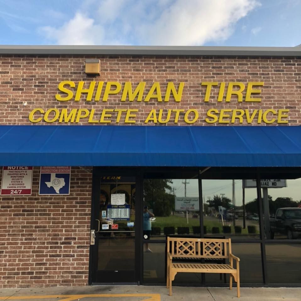A shipman tire complete auto service store with a blue awning