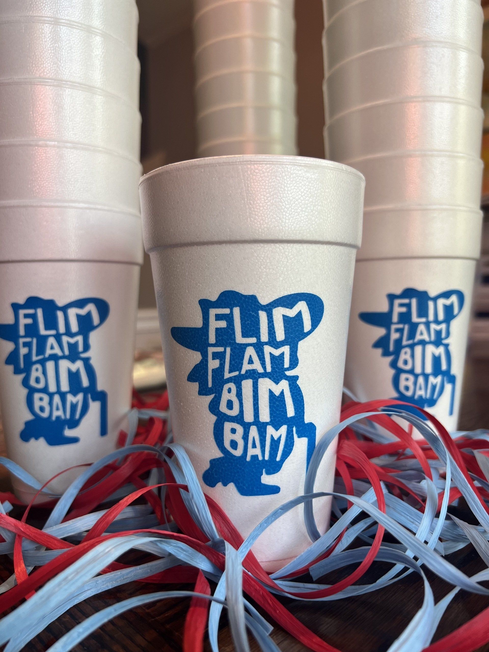 A stack of styrofoam cups with the words 