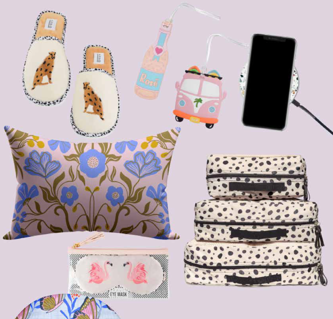 A pillow with flowers on it is surrounded by other items