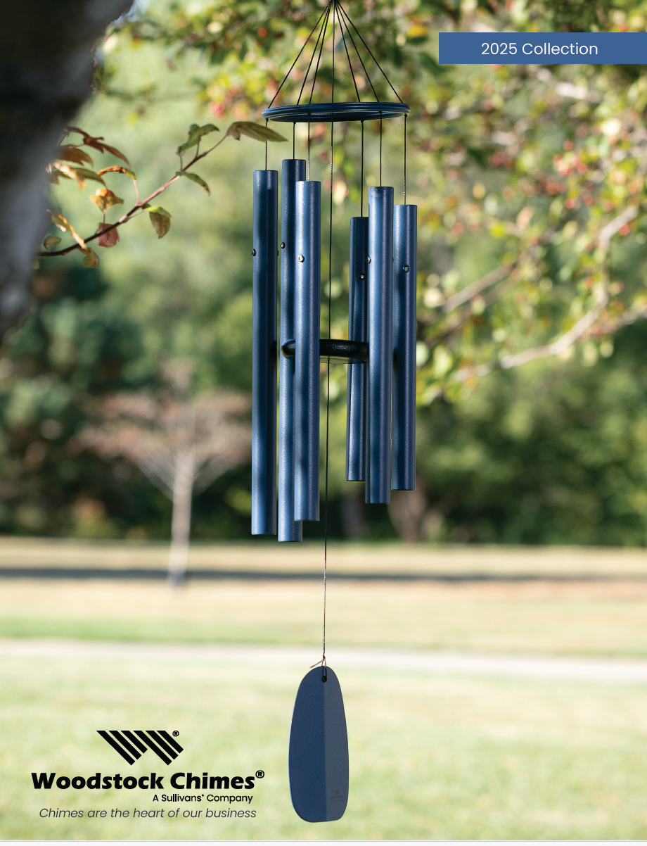 A blue woodstock chimes wind chime hanging from a tree