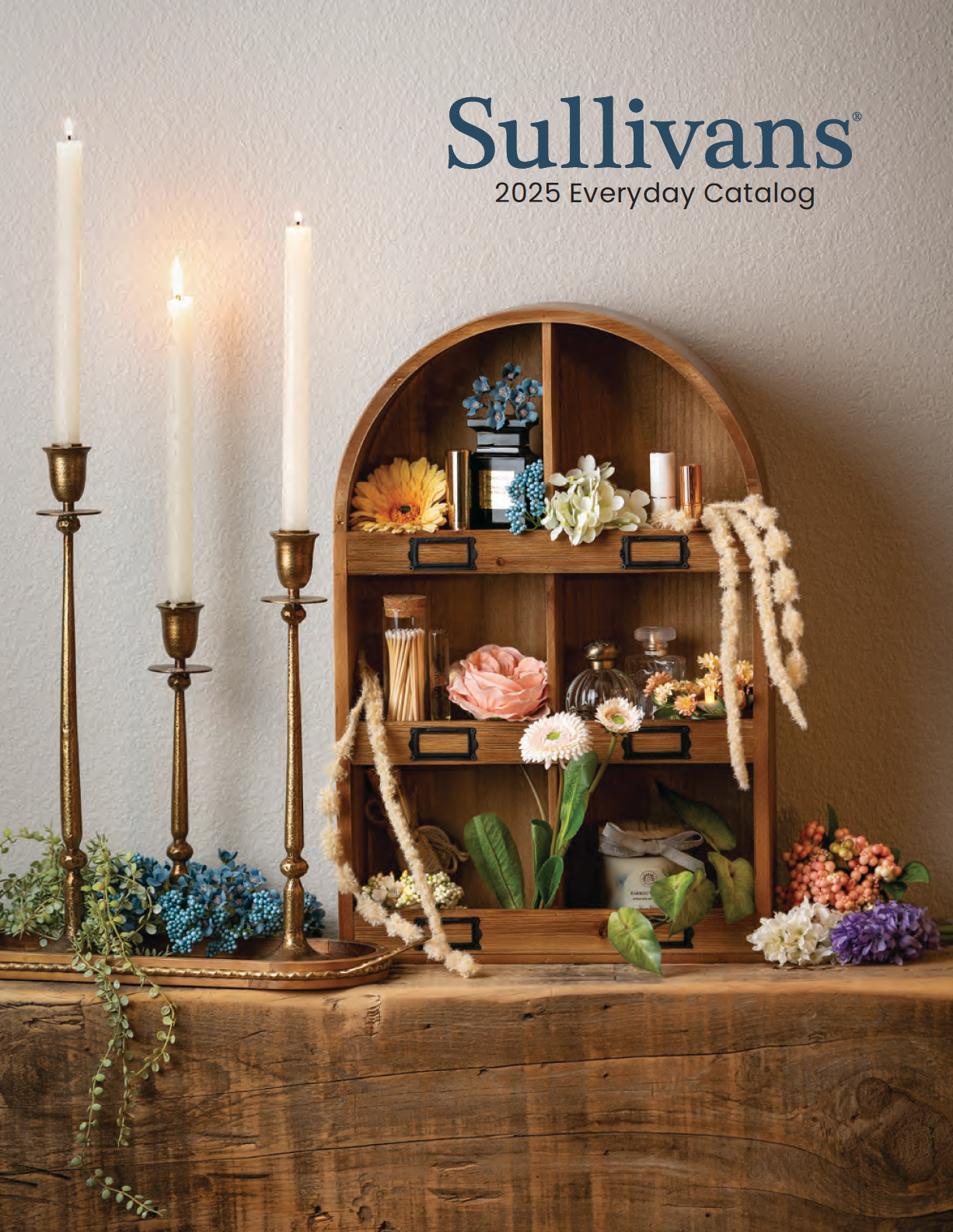 A wooden shelf with candles and flowers on it and the name sullivans on the top