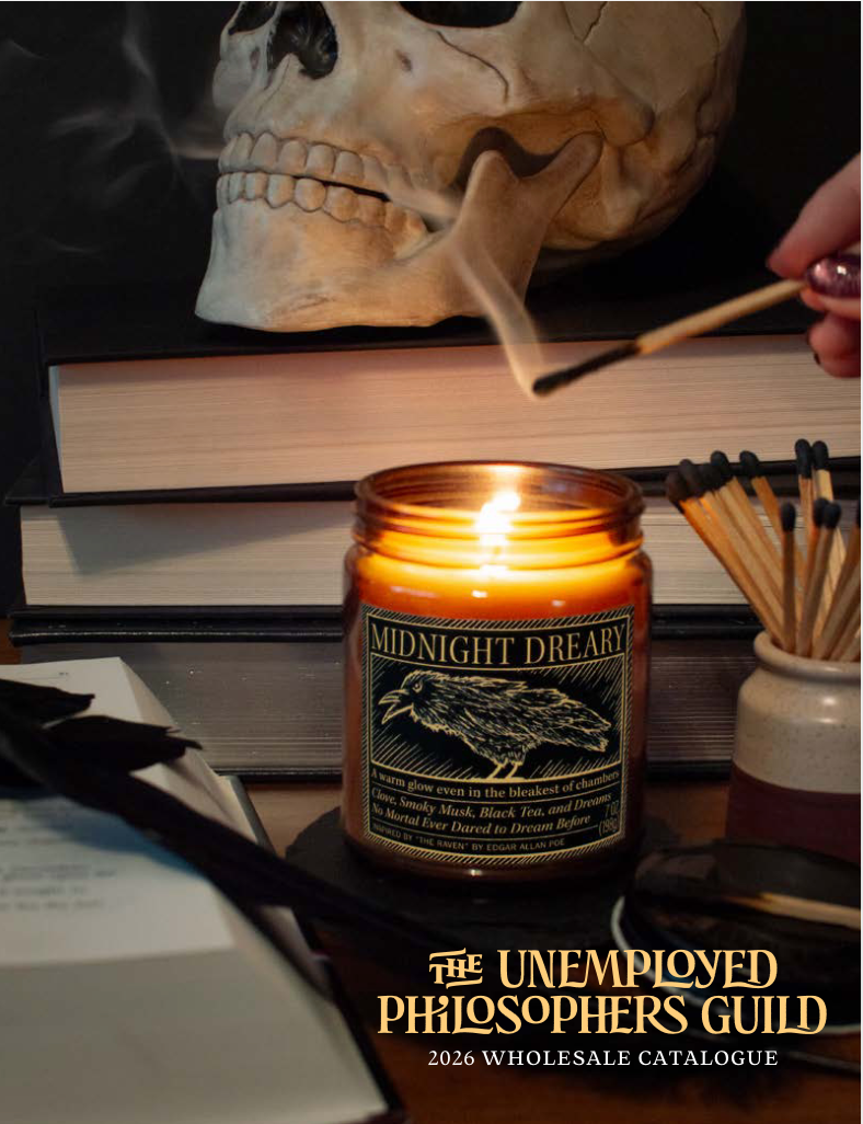 A woman is wearing a denim jacket that says the unemployed philosophers guild