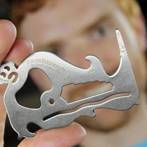 A man is holding a pocket monkey tool in his hand