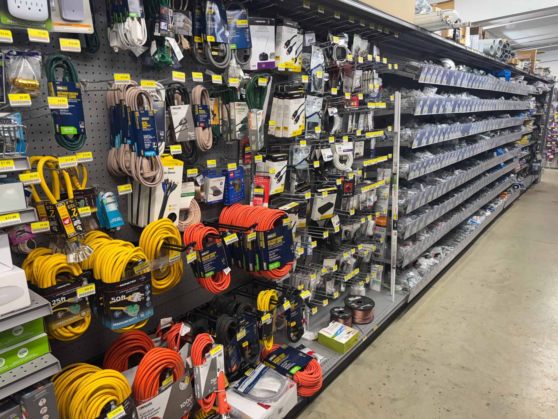 Pliers with blue handles and light bulbs on a gray background.