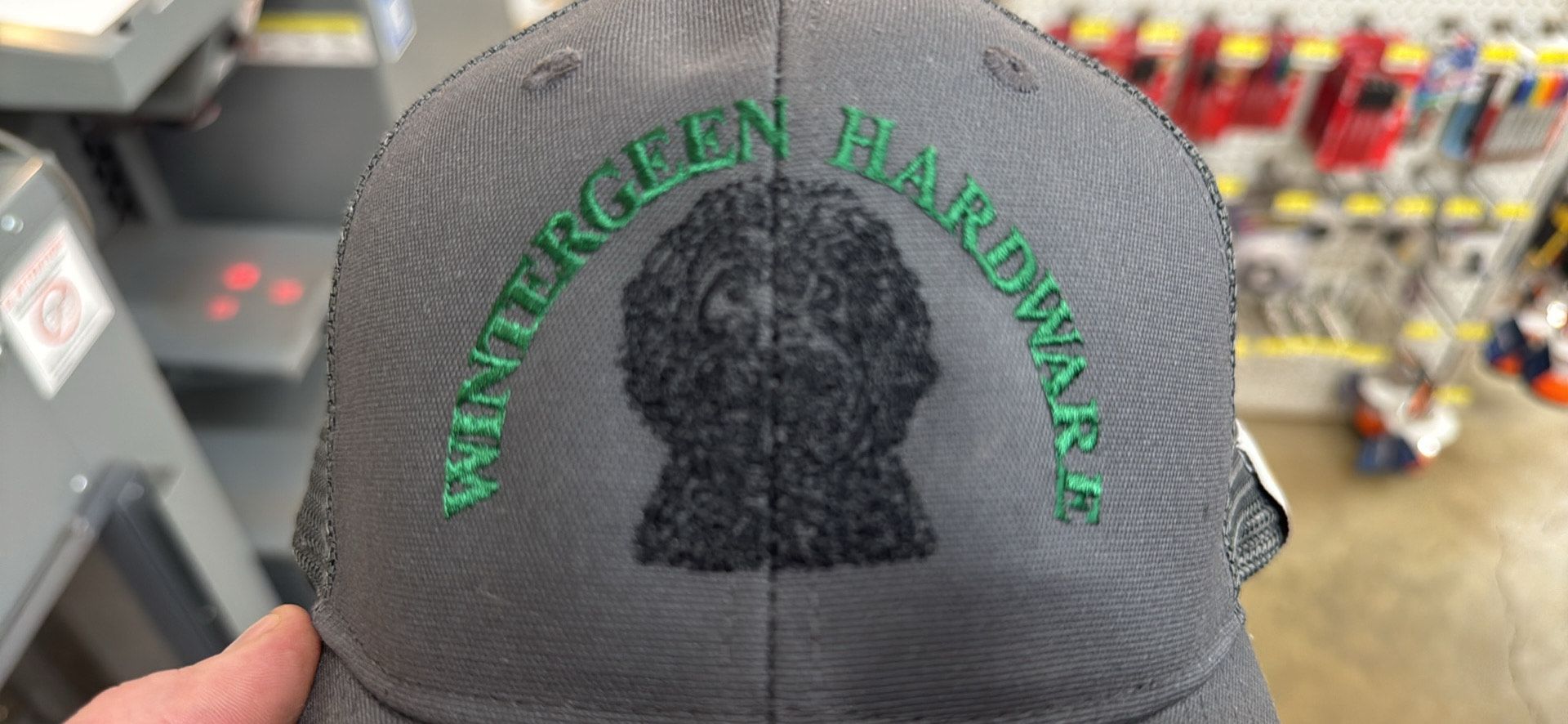 Close-up of a gray hat with the words 