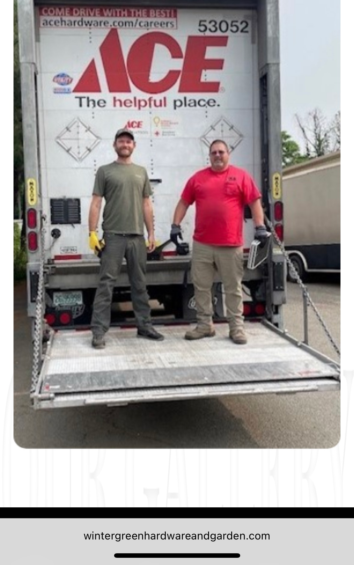 Two people holding cardboard packages with shipping labels.