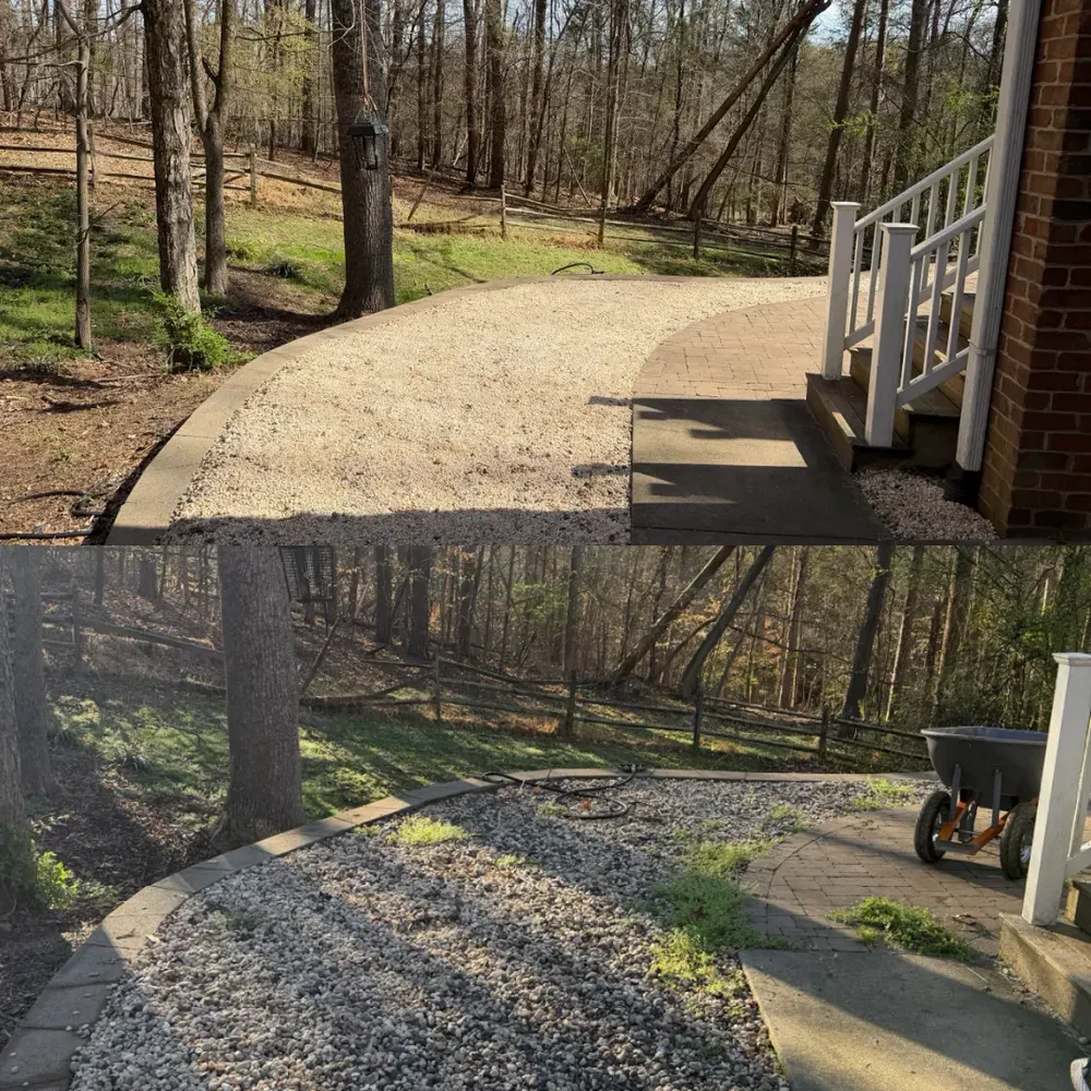 Curved gravel path by a brick house, with wooded yard and a small porch railing.
